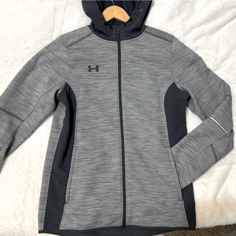 UA Storm fleece lined jacket. New w/o tags. Water resistant. Mens S